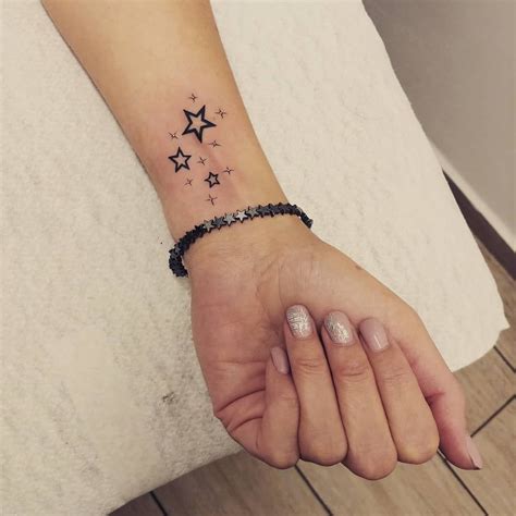 star finger tattoo|small star tattoos on wrist.